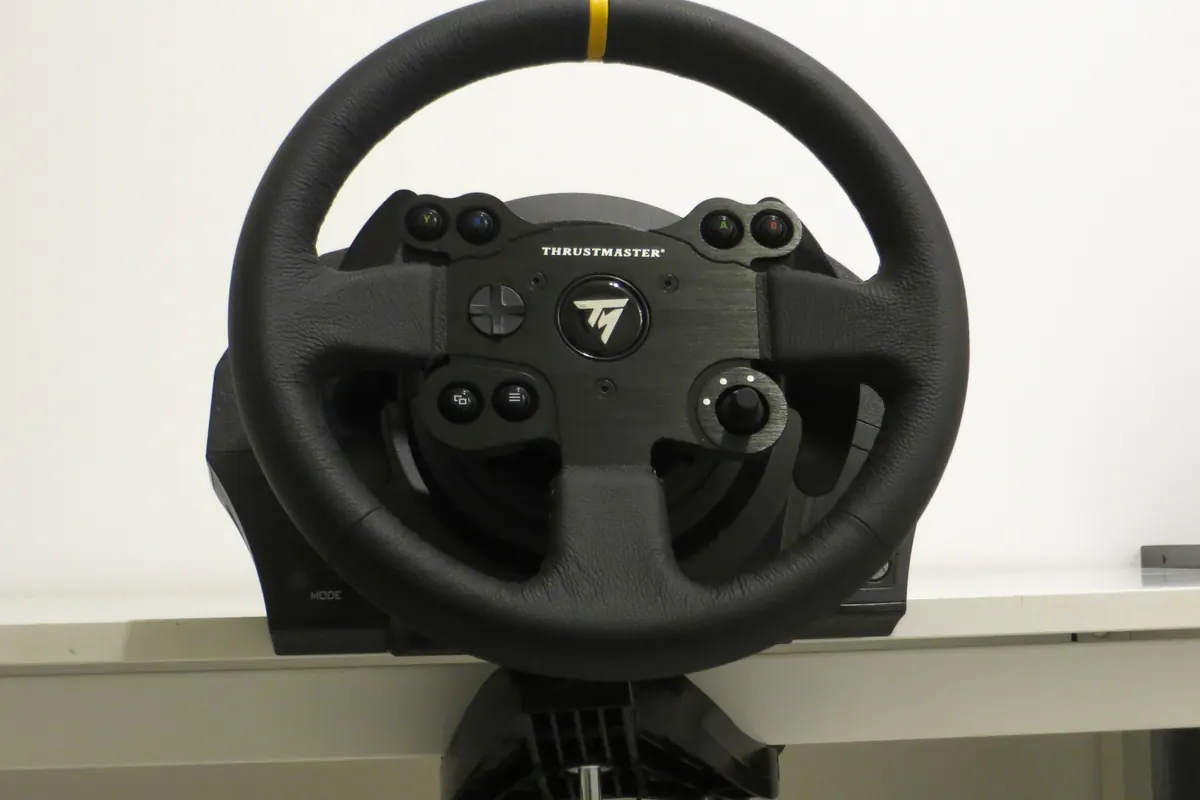 Thrustmaster TX Racing Wheel Leather Edition clamped to a desk